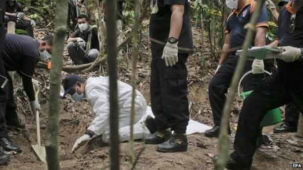 Malaysia exhumes mass ‘migrant’ graves