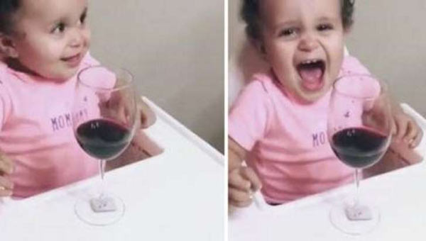 Only wine can make this baby smile!