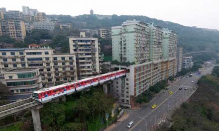 Chinese train that goes through block of flats